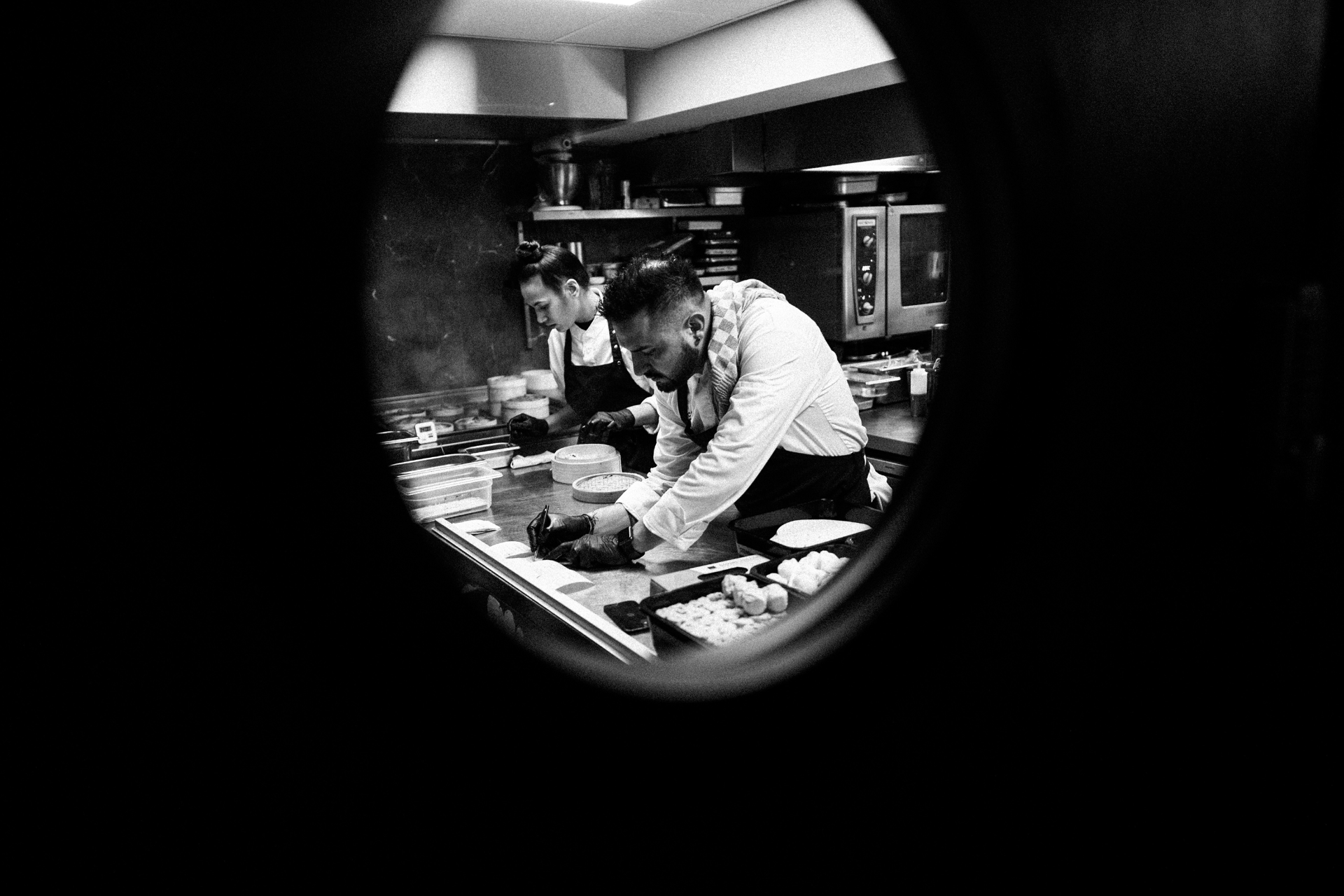 The kitchen through the porthole window